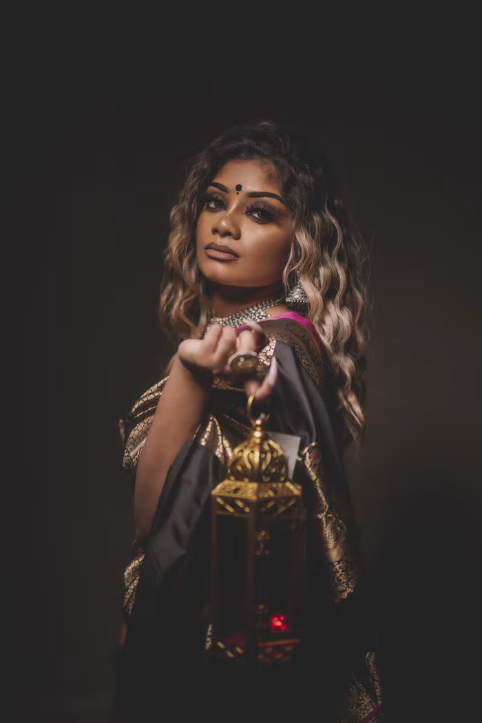 Highlighted wavy hair, silver jewelry and a gold lantern