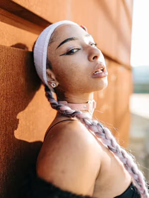 Twin braids, pink choker and gold grills