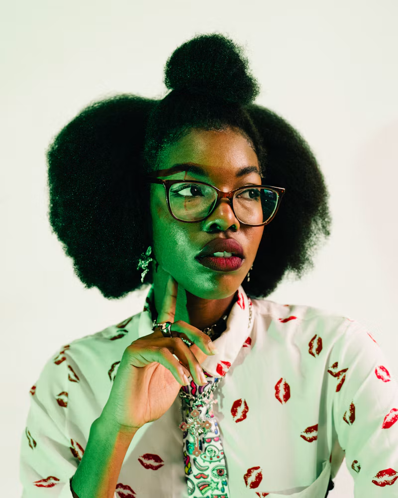 Natural afro and top knot, glasses and a patterned tie