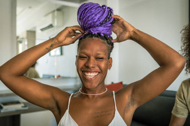 Purple braided updo and a joyful smile