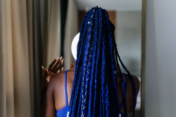 Electric-blue box braids with silver thread